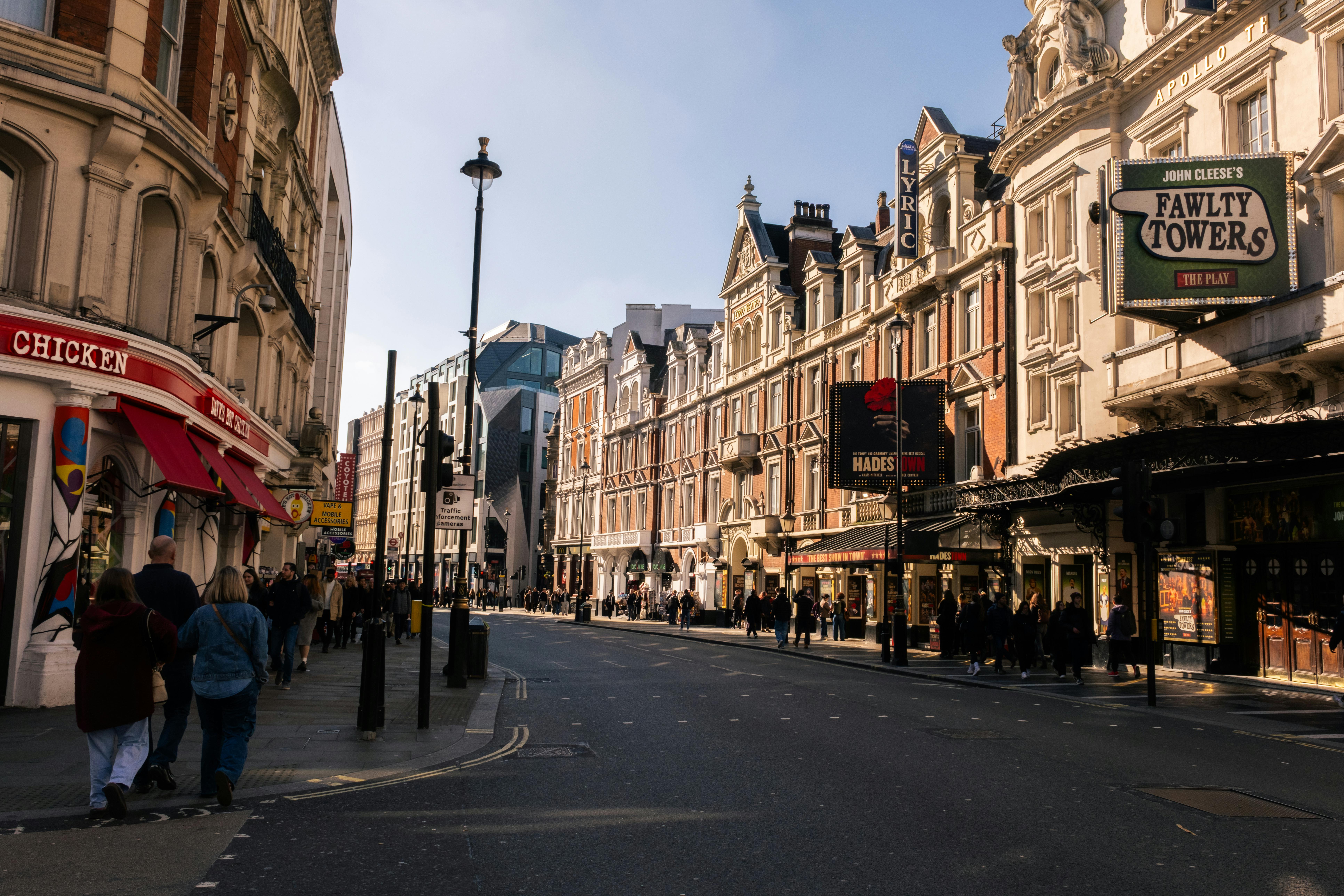 Free Bustling street in London featuring historic theatres and vibrant city life. Stock Photo