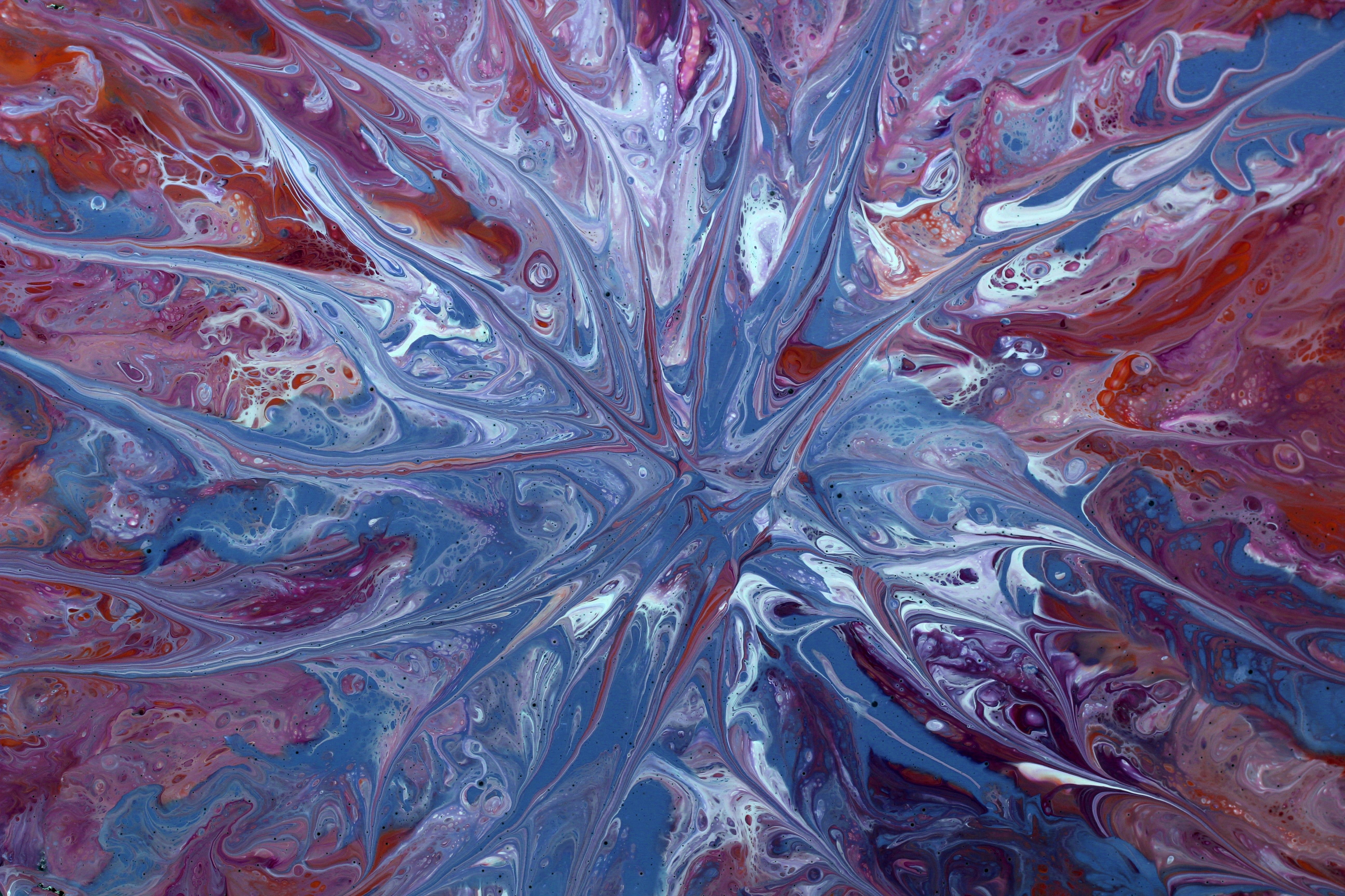 Vibrant abstract fluid art with swirling colors in an intricate pattern, perfect for modern decor.