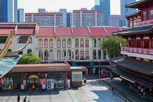 Explore the colorful architecture and bustling life of Singapore's Chinatown.