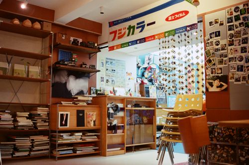 Free Cozy and colorful interior of a vintage Fujicolor shop in Japan with books and decor. Stock Photo