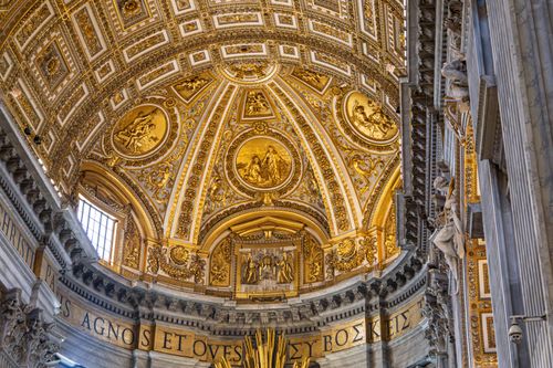 Free Intricate gold and stone plasterwork inside St. Peter's Basilica, Vatican City. Stock Photo