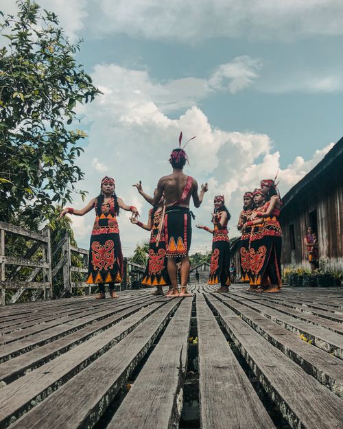 Free Cultural dance performance in traditional attire in West Kalimantan, Indonesia. Stock Photo