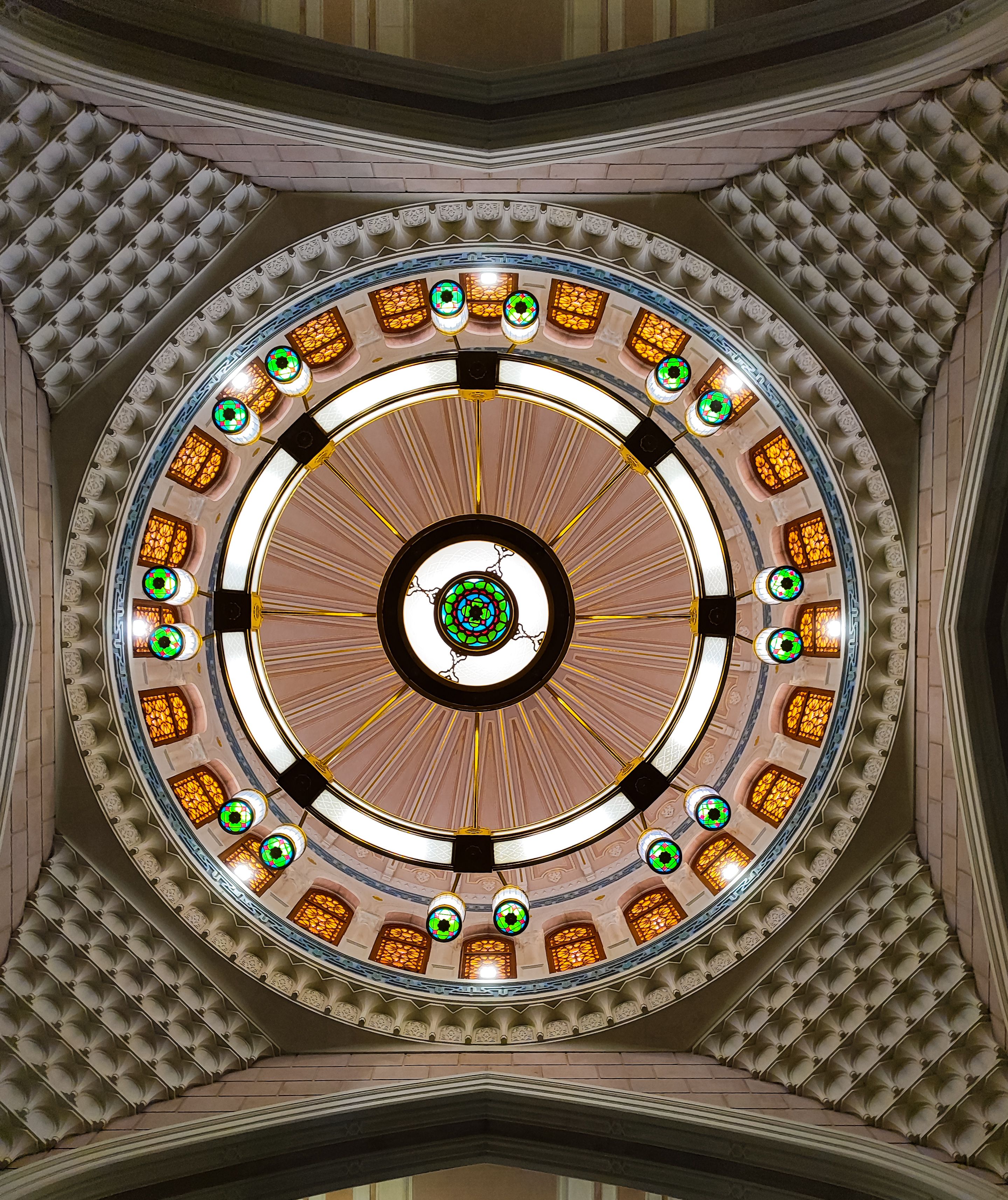 Intricate dome ceiling architecture in Makkah, featuring detailed patterns and vibrant colors.