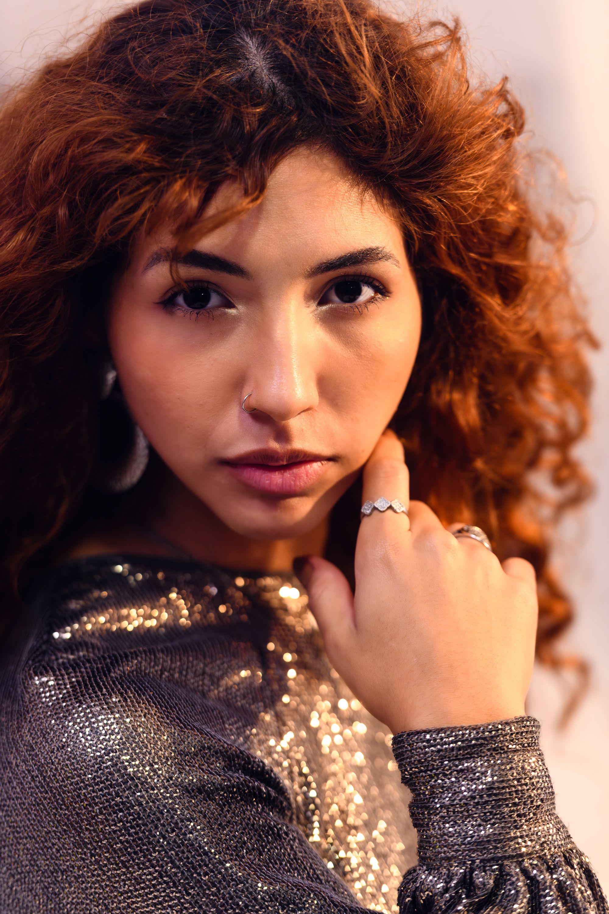 Stylish Portrait of a Woman with Curly Hair · Free Stock Photo