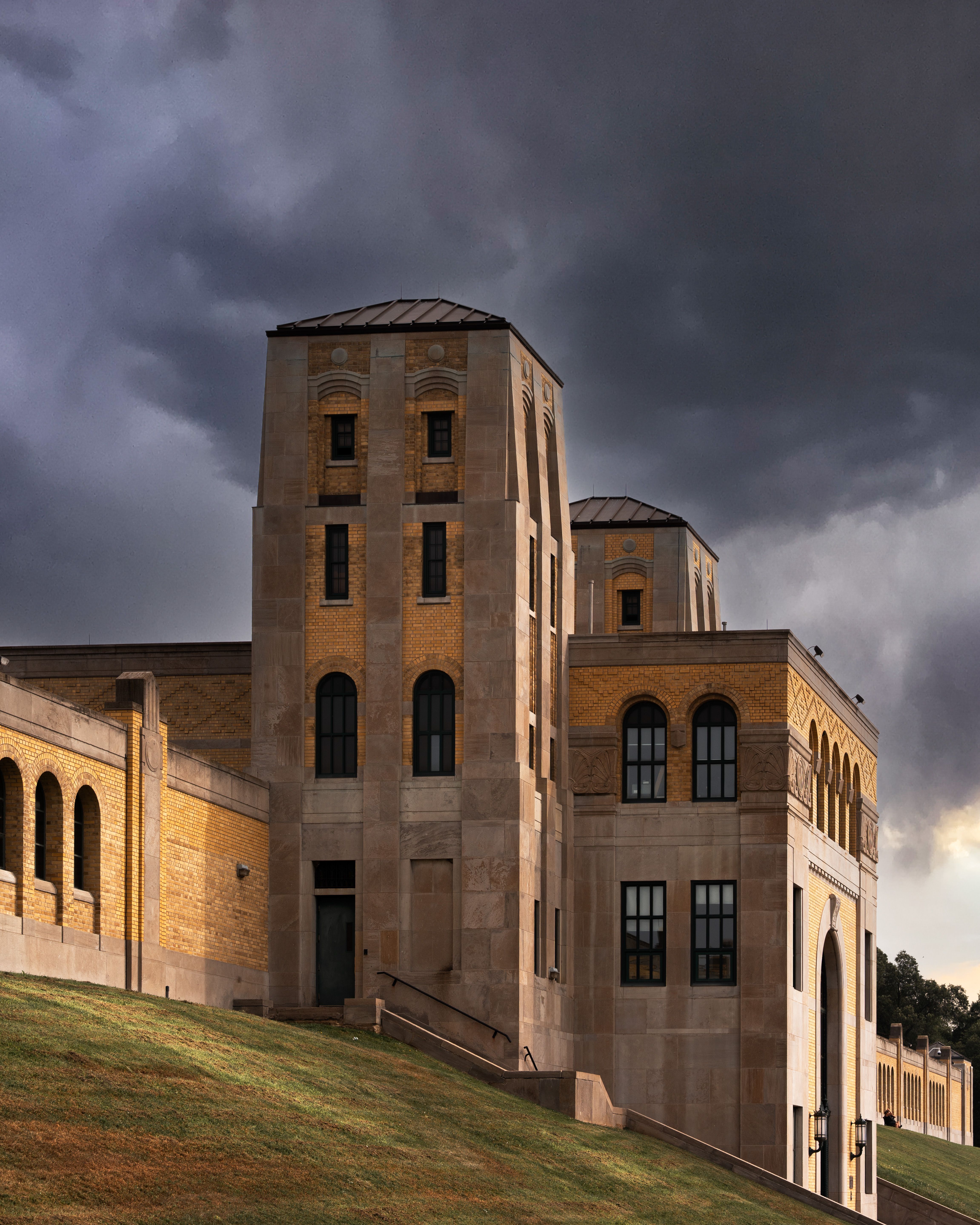 Historic Brick Building with Stormy Sky · Free Stock Photo