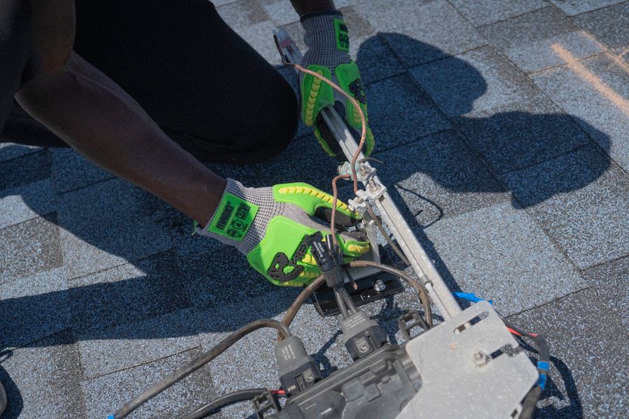 Technician inspecting electrical connections