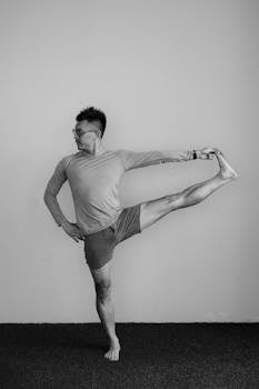 Yoga practitioner performing a standing pose indoors, showcasing flexibility and balance.