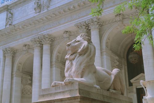 Free Iconic Patience lion statue at the New York Public Library main entrance. Stock Photo