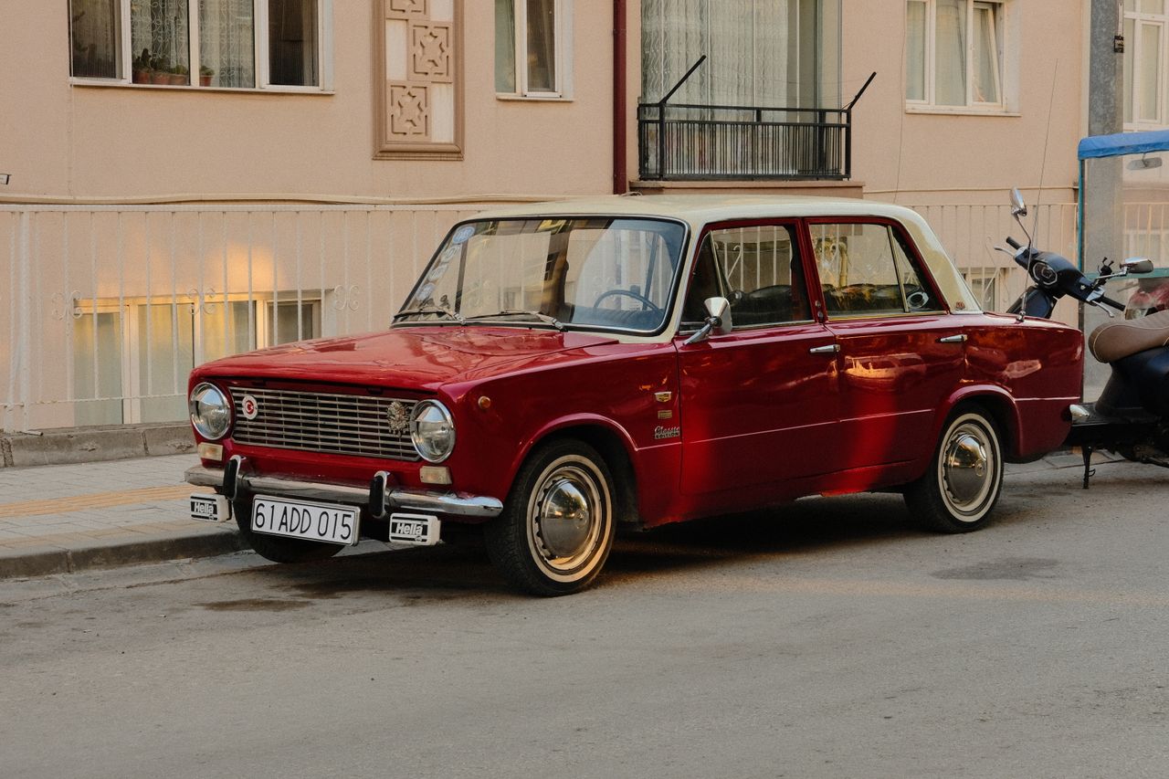 classic 1960s red car parked on a quiet street in ank r t rkiye showca