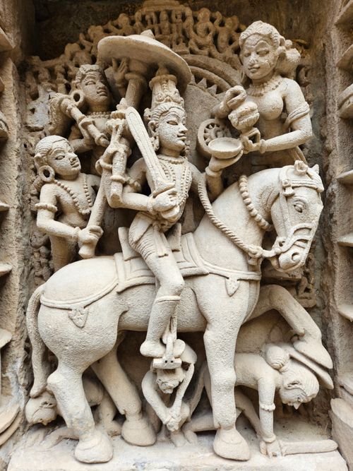Free Detailed stone sculpture depicting historical figures on horseback, showcasing rich artistry. Stock Photo