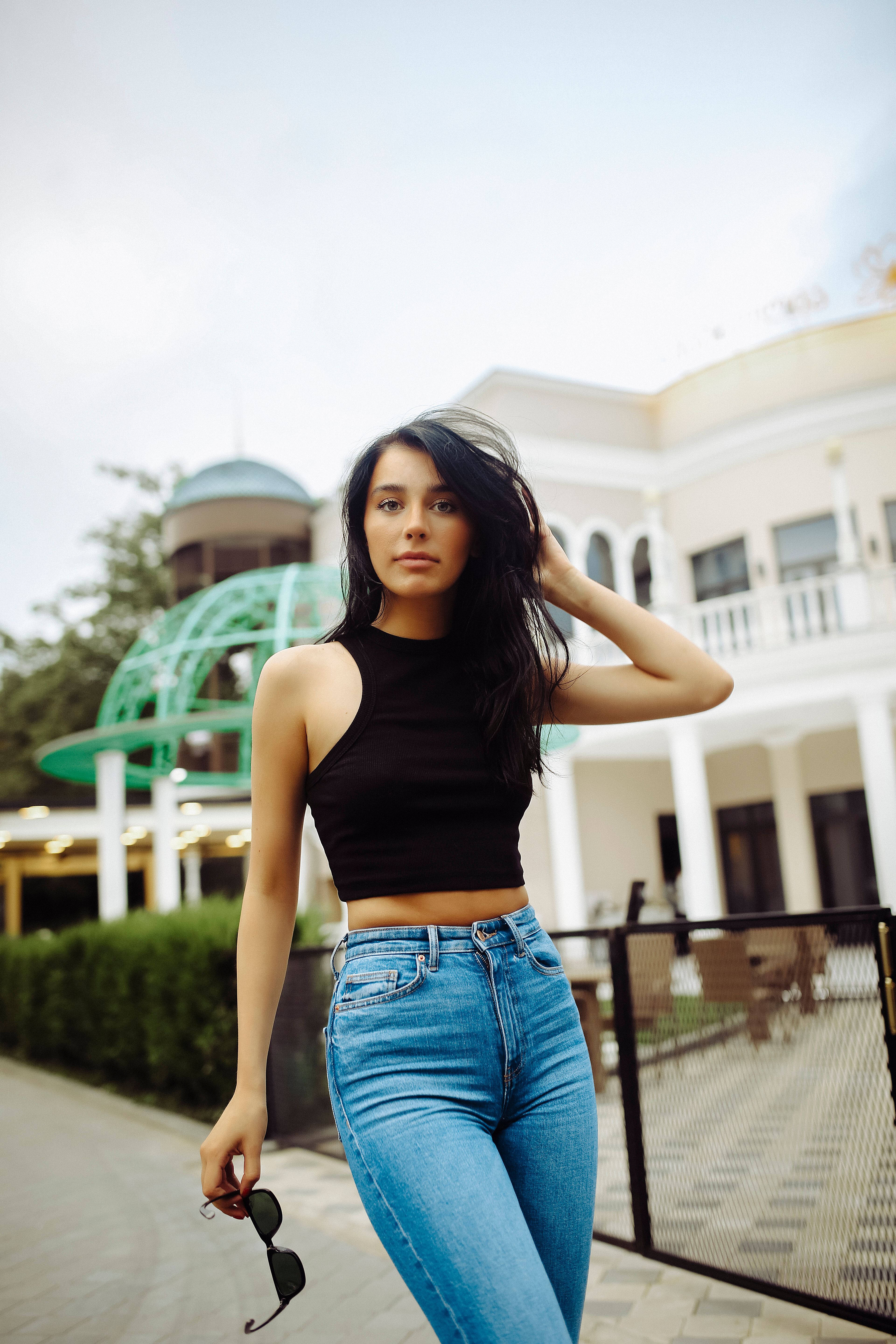 Elegant Woman Posing Outdoors in Urban Setting · Free Stock Photo