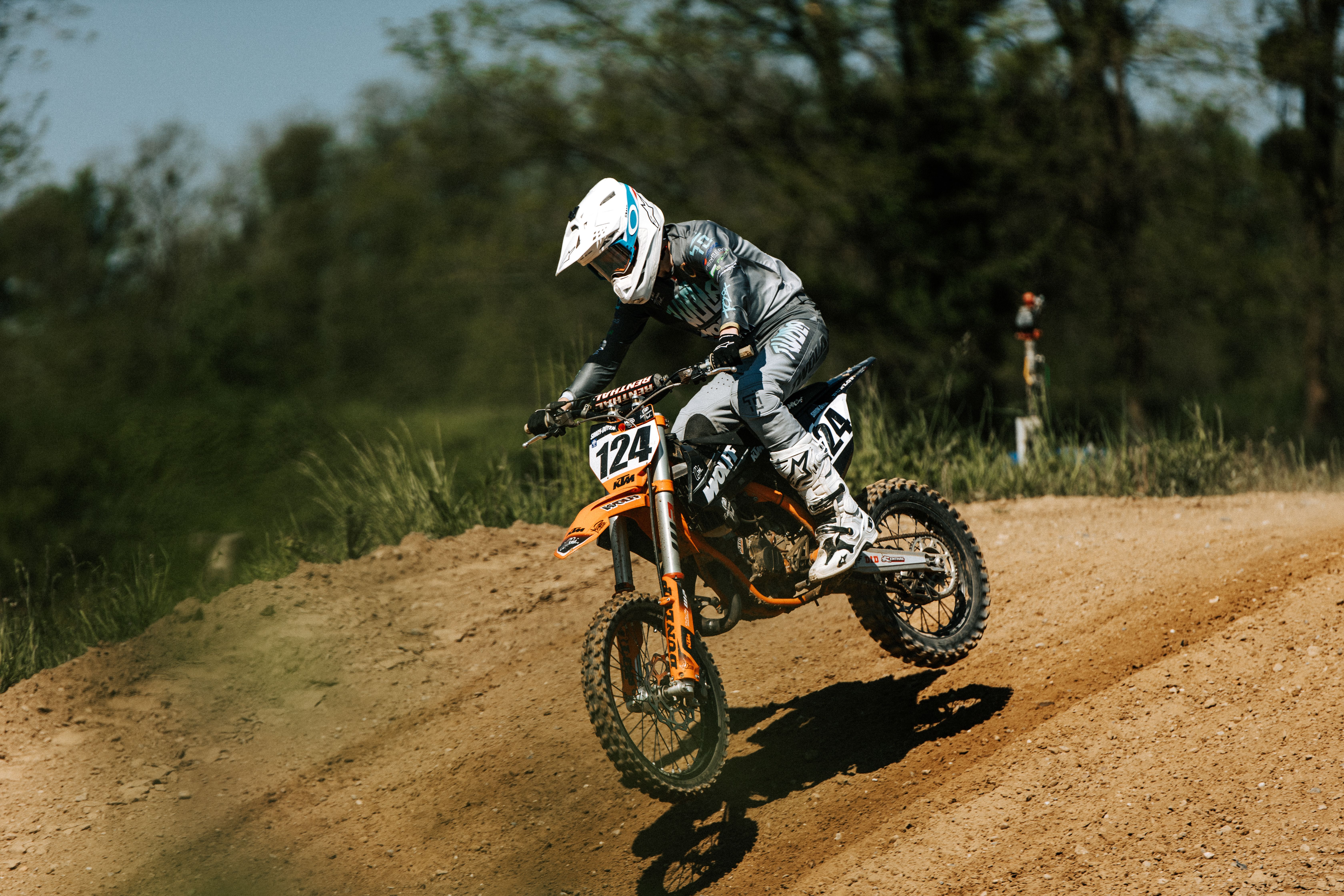 Dynamic Motocross Rider Jumping on Dirt Track · Free Stock Photo