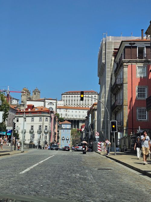 Free Urban scene with historic buildings under clear blue sky in daylight. Stock Photo
