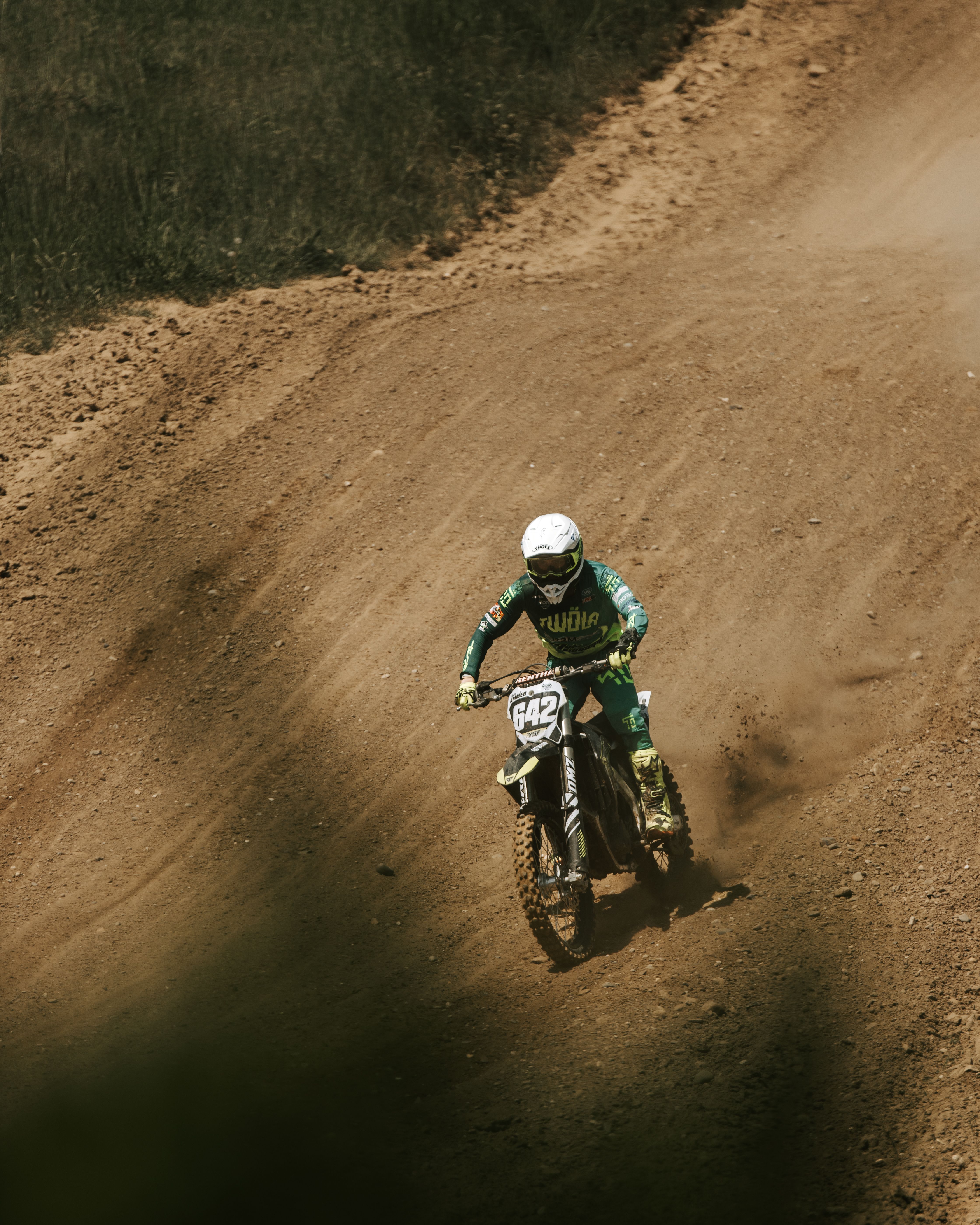 Dynamic Motocross Rider on Dirt Track · Free Stock Photo