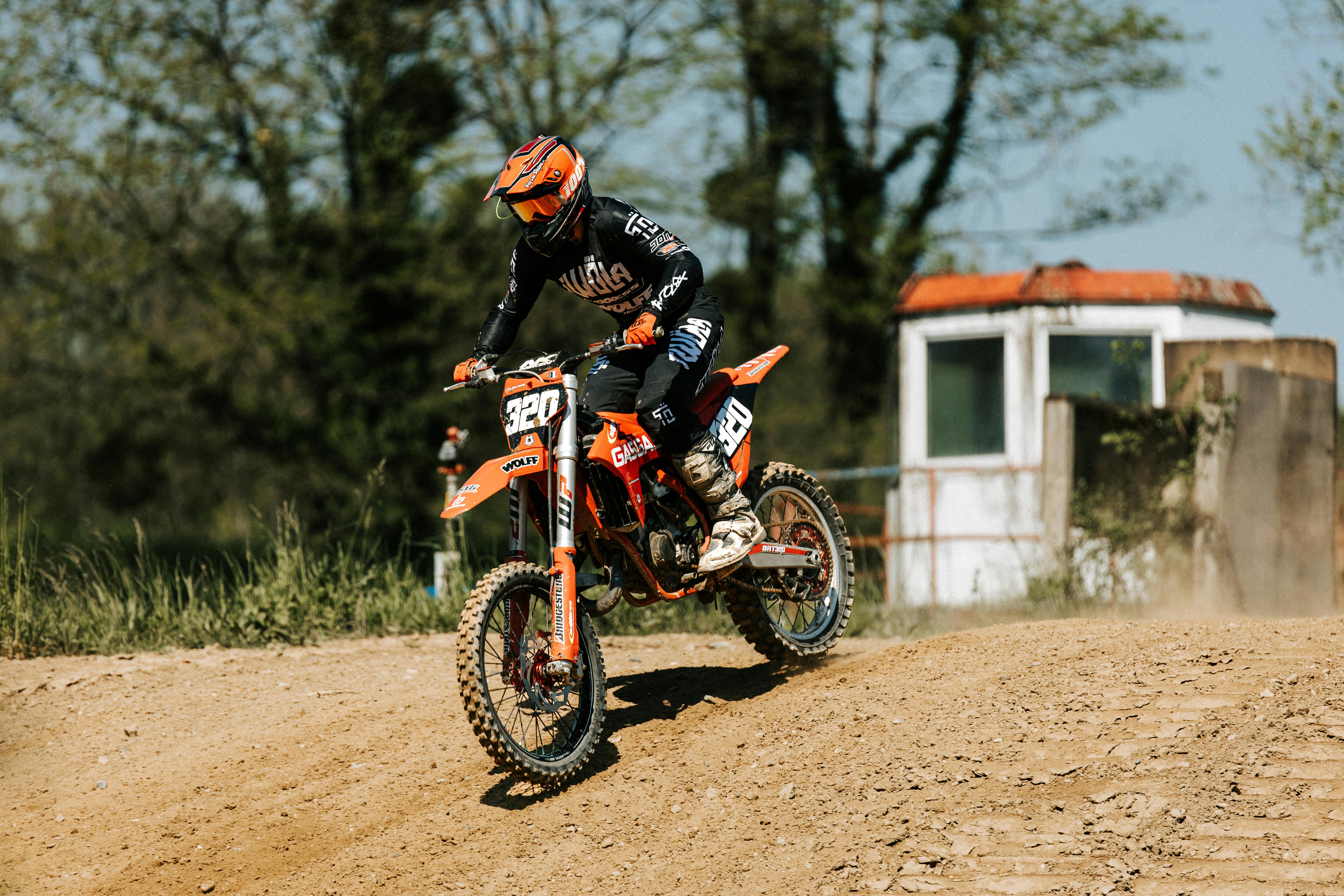 Exciting motocross action with a rider on a dirt track. Perfect for motorsport enthusiasts.