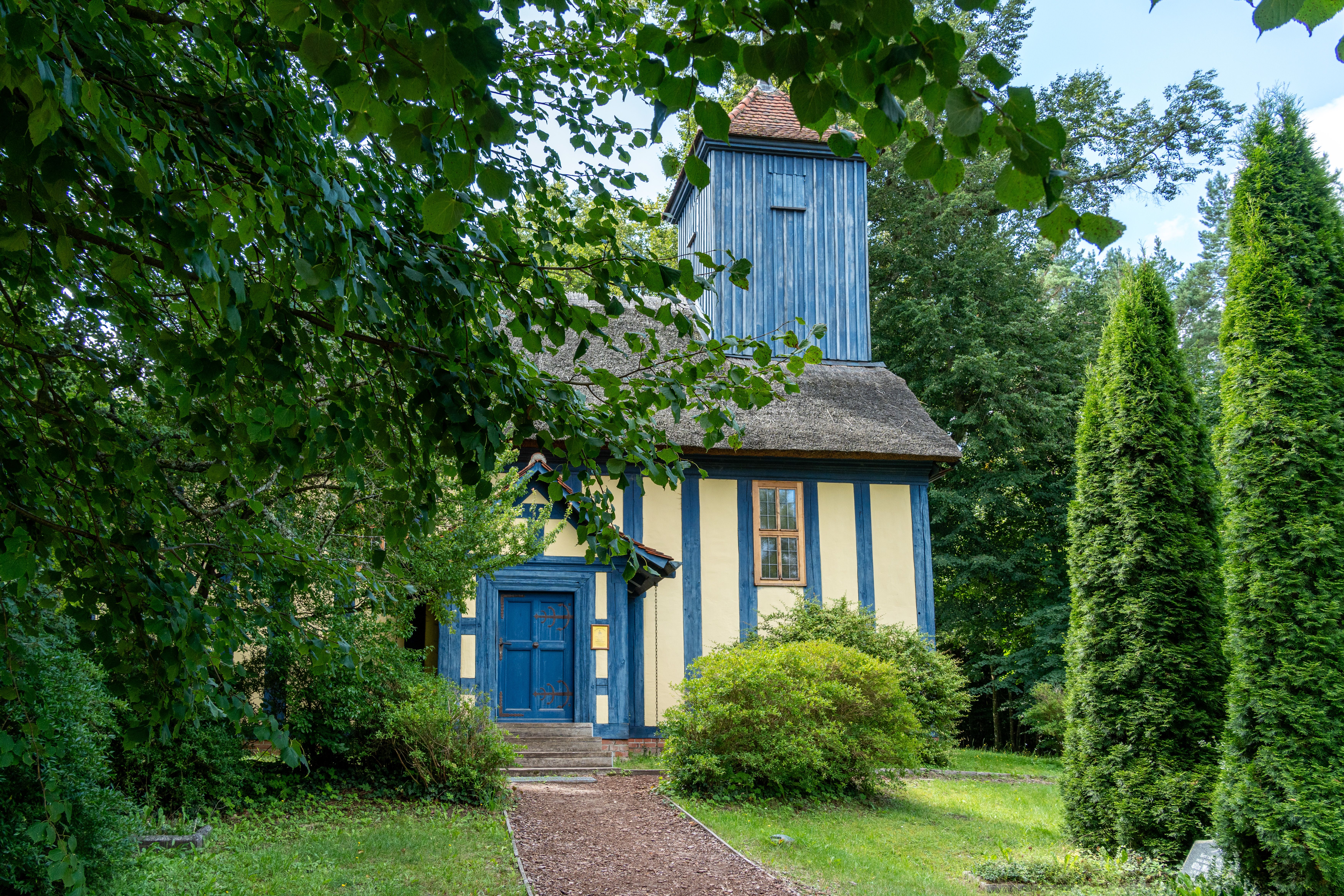 Charming Rustic Village Church in Lush Forest · Free Stock Photo