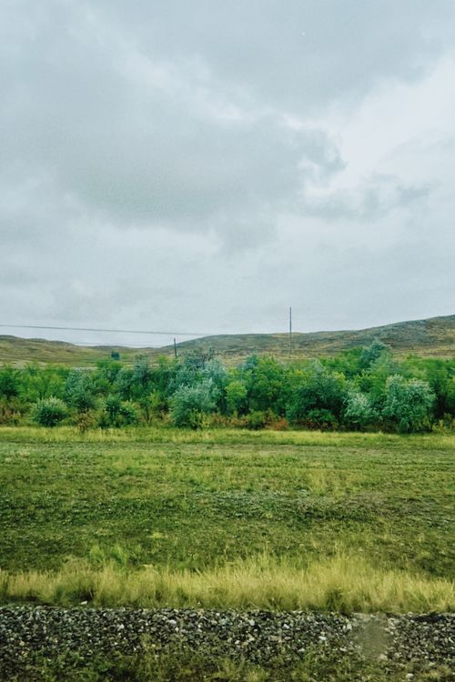 Free Serene outdoor landscape in Oskemen, Kazakhstan, showcasing lush greenery under cloudy skies. Stock Photo