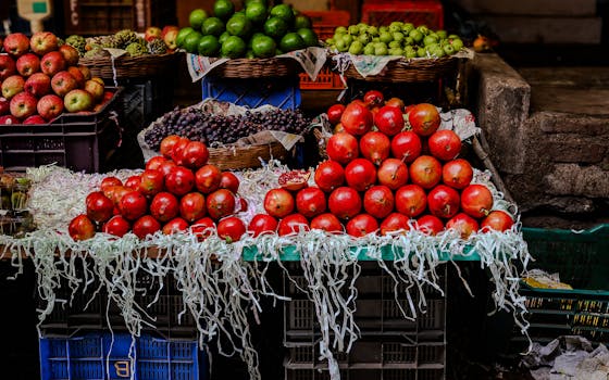 A vibrant display of assorted fruits in a lively market setting.