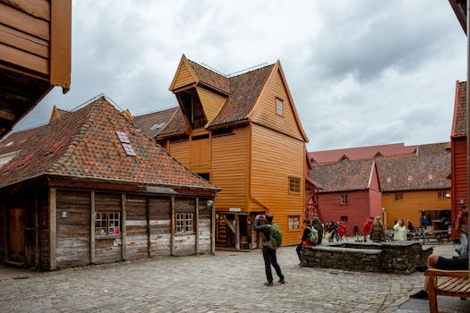 Explore the colorful wooden structures of Bryggen in Bergen, Norway's historic harbor district.