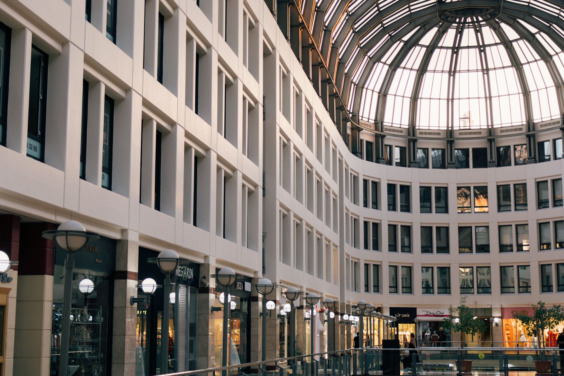 Elegant interior of a modern shopping mall with a striking glass dome in Ankara, Türkiye.