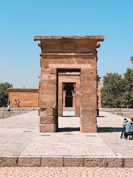 Ancient Egyptian architecture in a sunny park setting, capturing historical elegance.