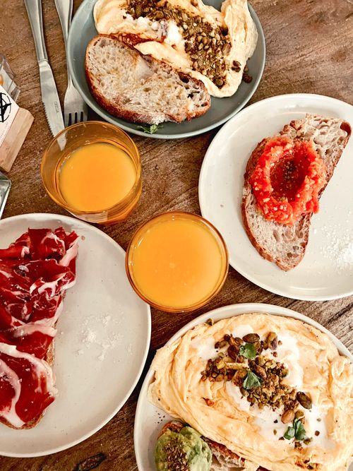 Free A vibrant breakfast spread featuring toast, toppings, and fresh orange juice. Stock Photo