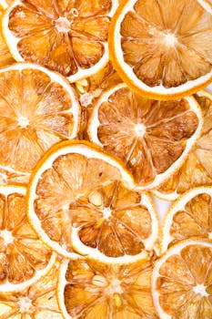 Bright close-up image of dried orange slices highlighting texture and color.