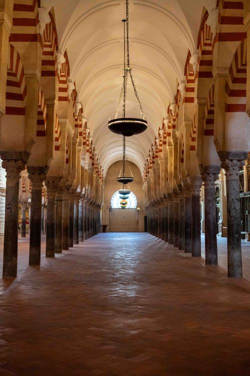 Free Beautiful view of the historic Mosque-Cathedral of Córdoba interior with iconic arches. Stock Photo