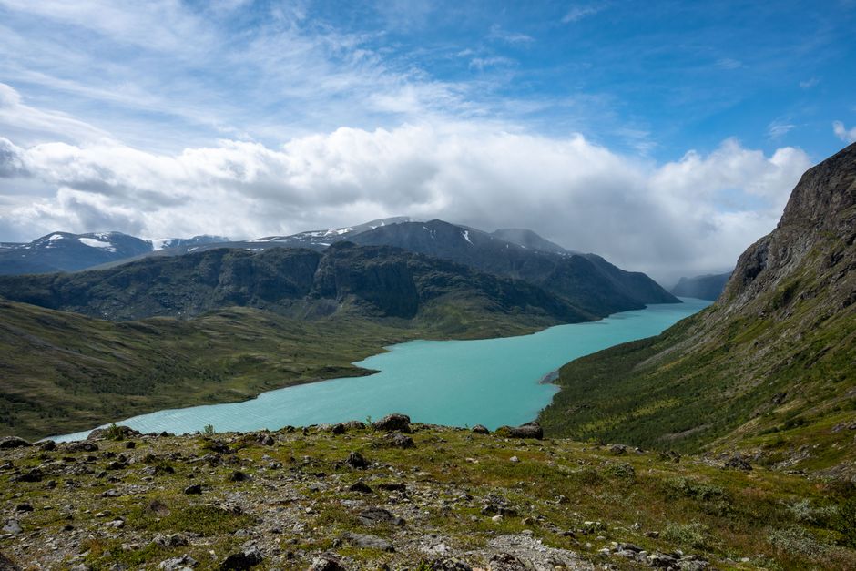 A physical Turkart hiking map of the Jotunheimen region in Norway, laid out on a table