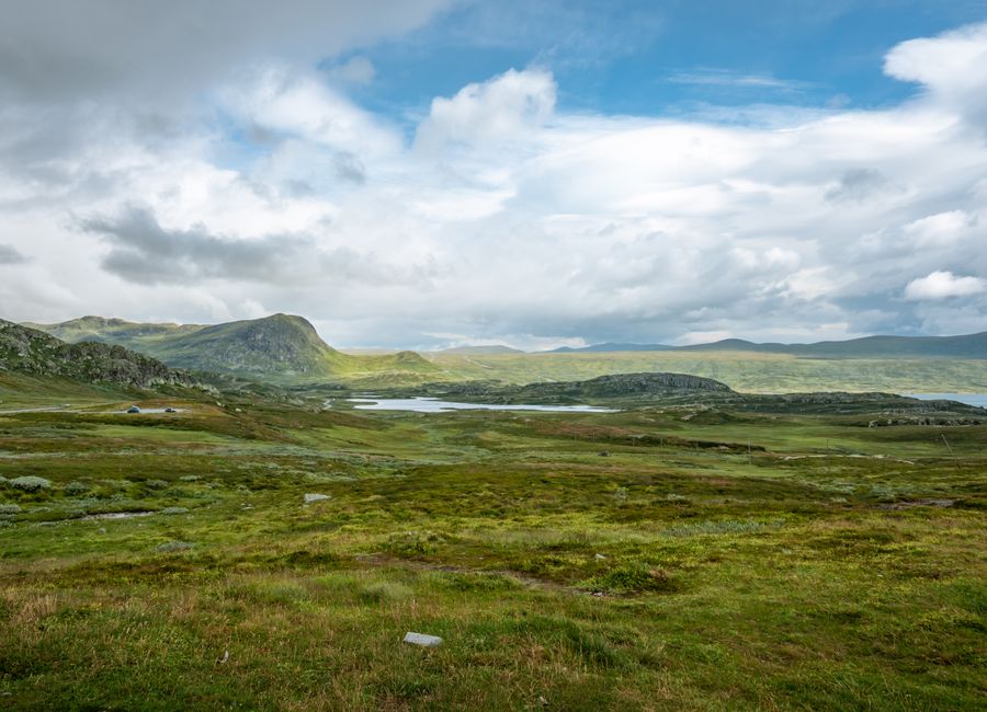Breathtaking landscape view of mountains and sky in Innlandet, Norway.