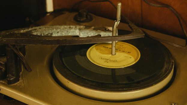 Classic gramophone playing an old vinyl record, exuding nostalgia and retro charm.