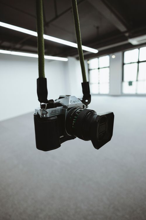 Camera Hanging in Minimalist Industrial Space · Free Stock Photo