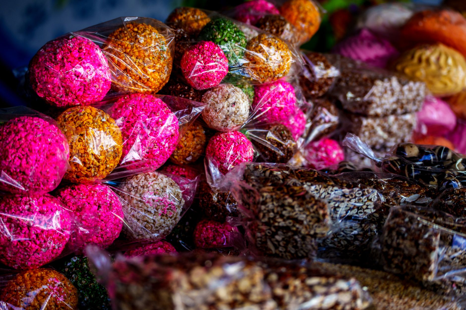 Colorful traditional Guatemalan sweets wrapped in plastic on display at a market in Ciudad de Guatemala.