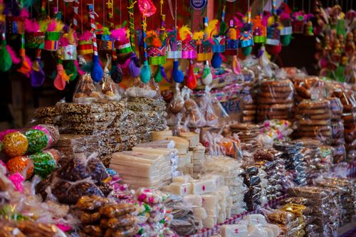 Free Colorful assortment of traditional sweets and candies at a Mexican market stall. Stock Photo