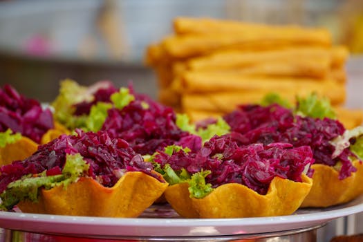 Vibrant Guatemalan tostada topped with red cabbage and lettuce, showcasing local cuisine.