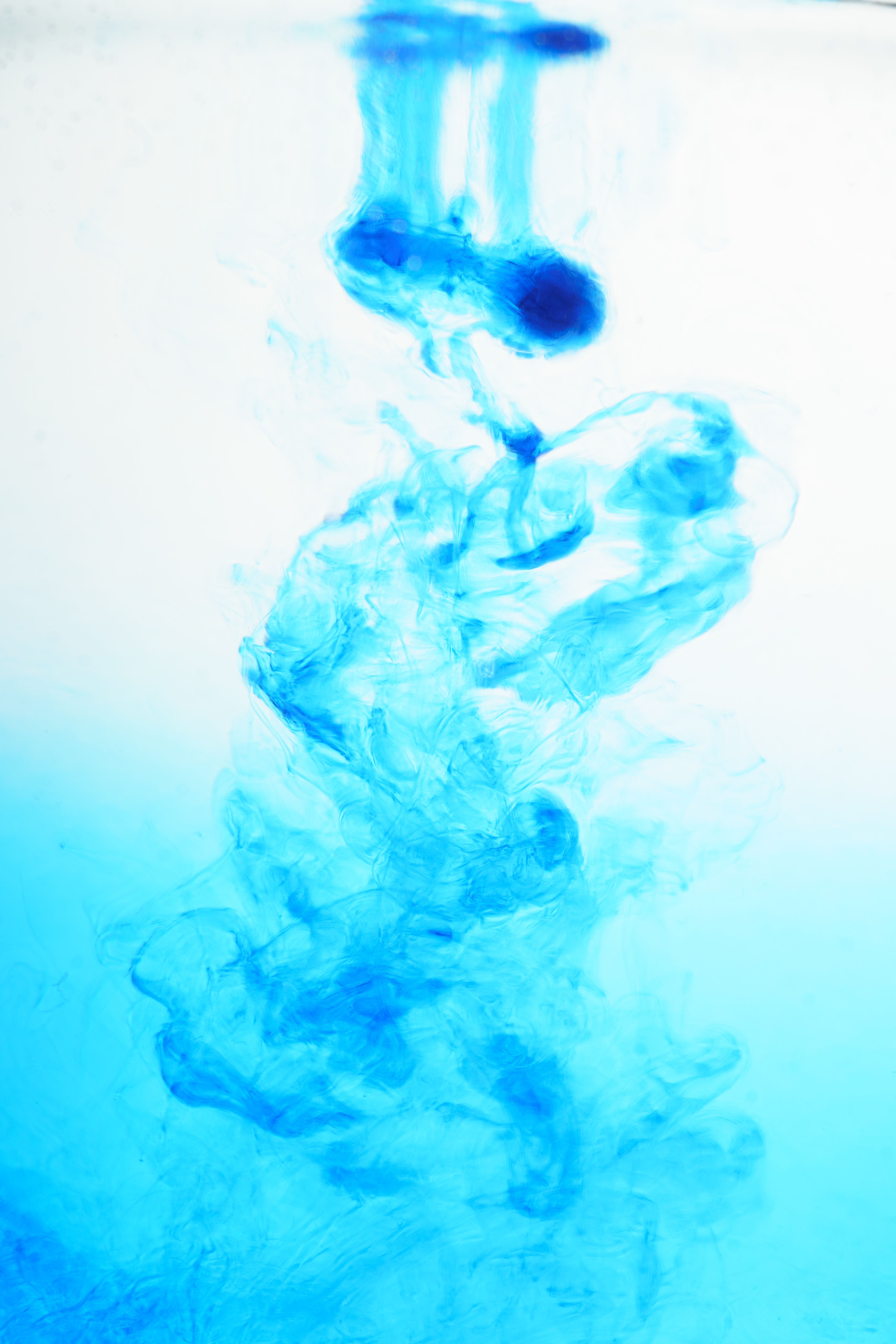 Vibrant Blue Ink Swirling in Water Close-up · Free Stock Photo