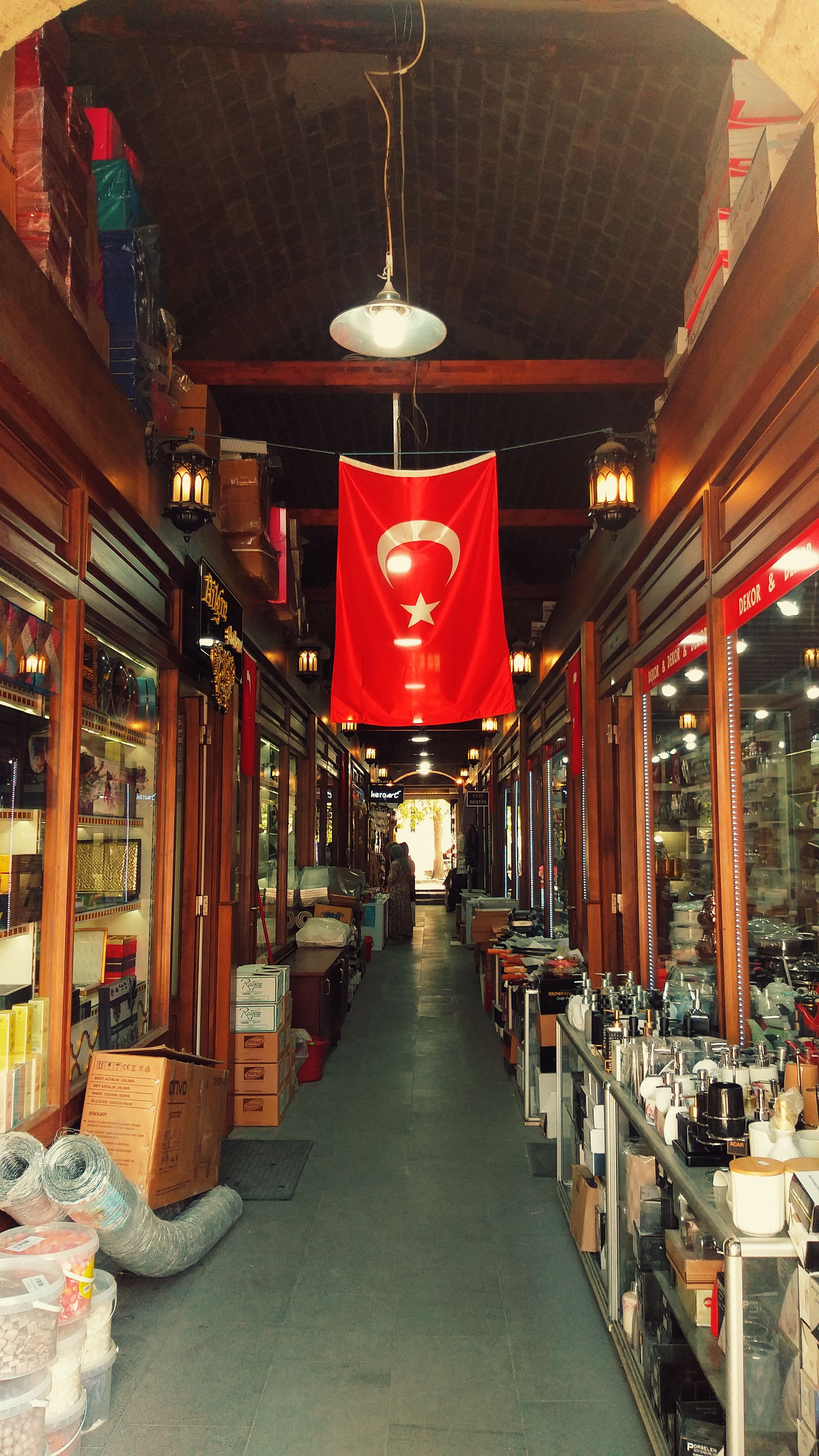 Explore a traditional indoor Turkish market in Isparta, featuring local goods and crafts.