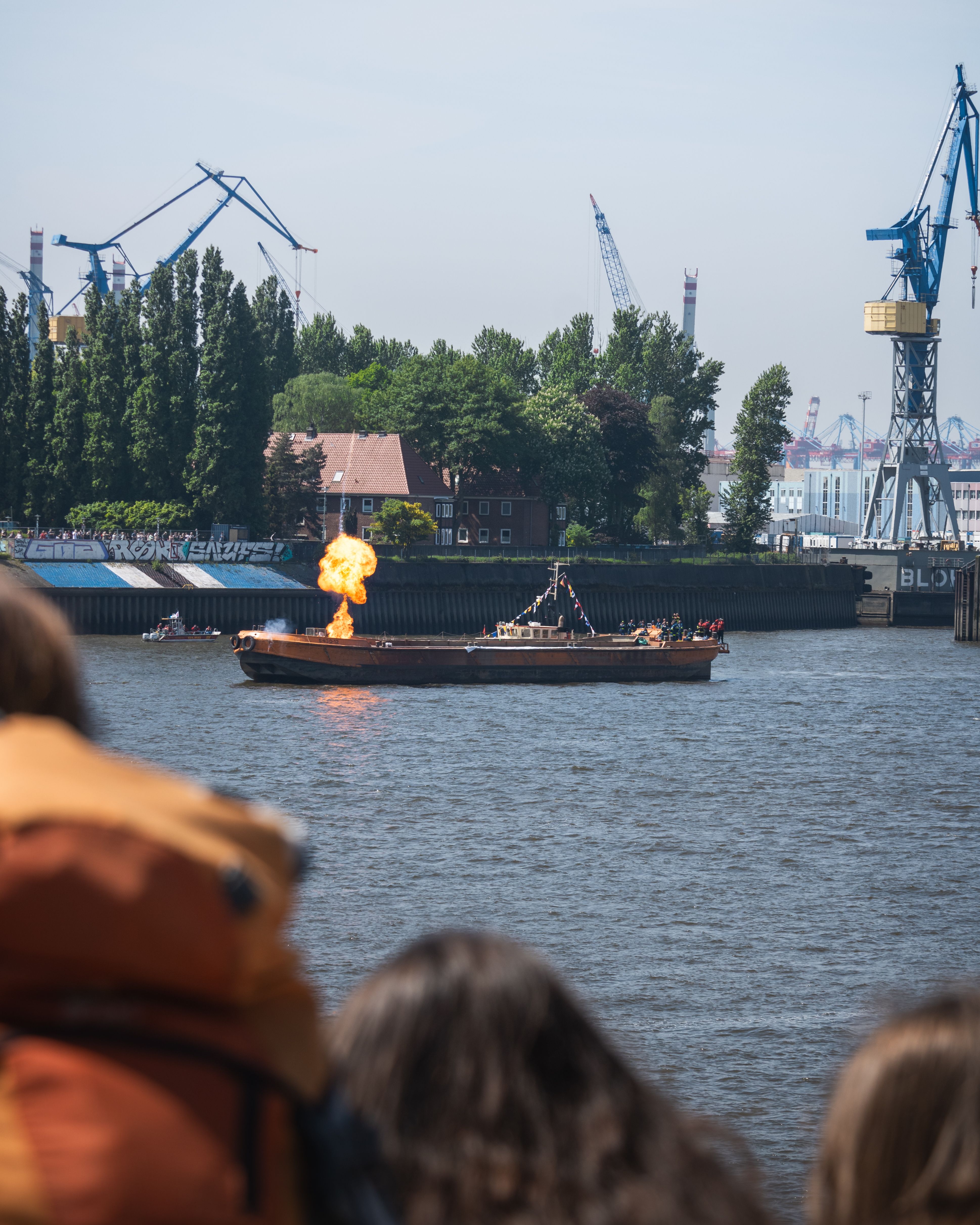 Witness a dramatic fire show on a boat during Hamburg's maritime festival.
