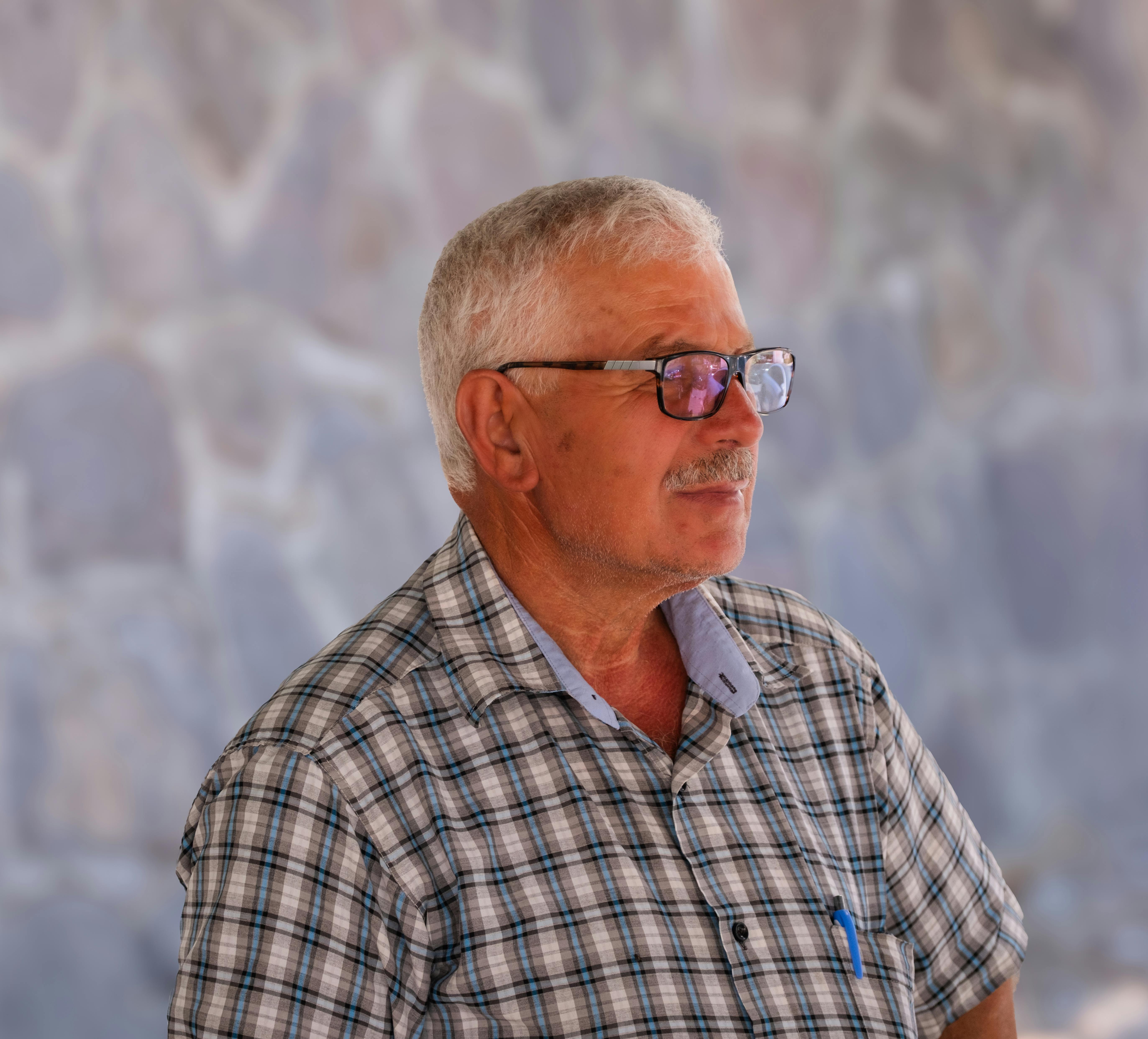 Close-up portrait of a senior man wearing glasses in Izmir, Turkey.