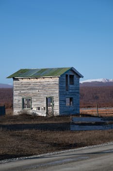 Old wooden house in a remote landscape of Tierra del Fuego, Argentina.