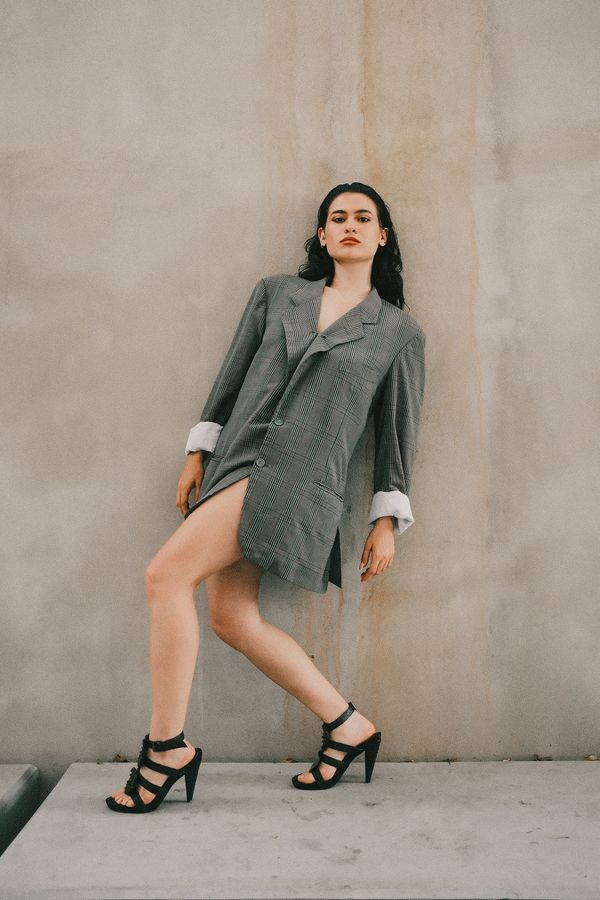 Woman wearing a double-breasted blazer as a dress
