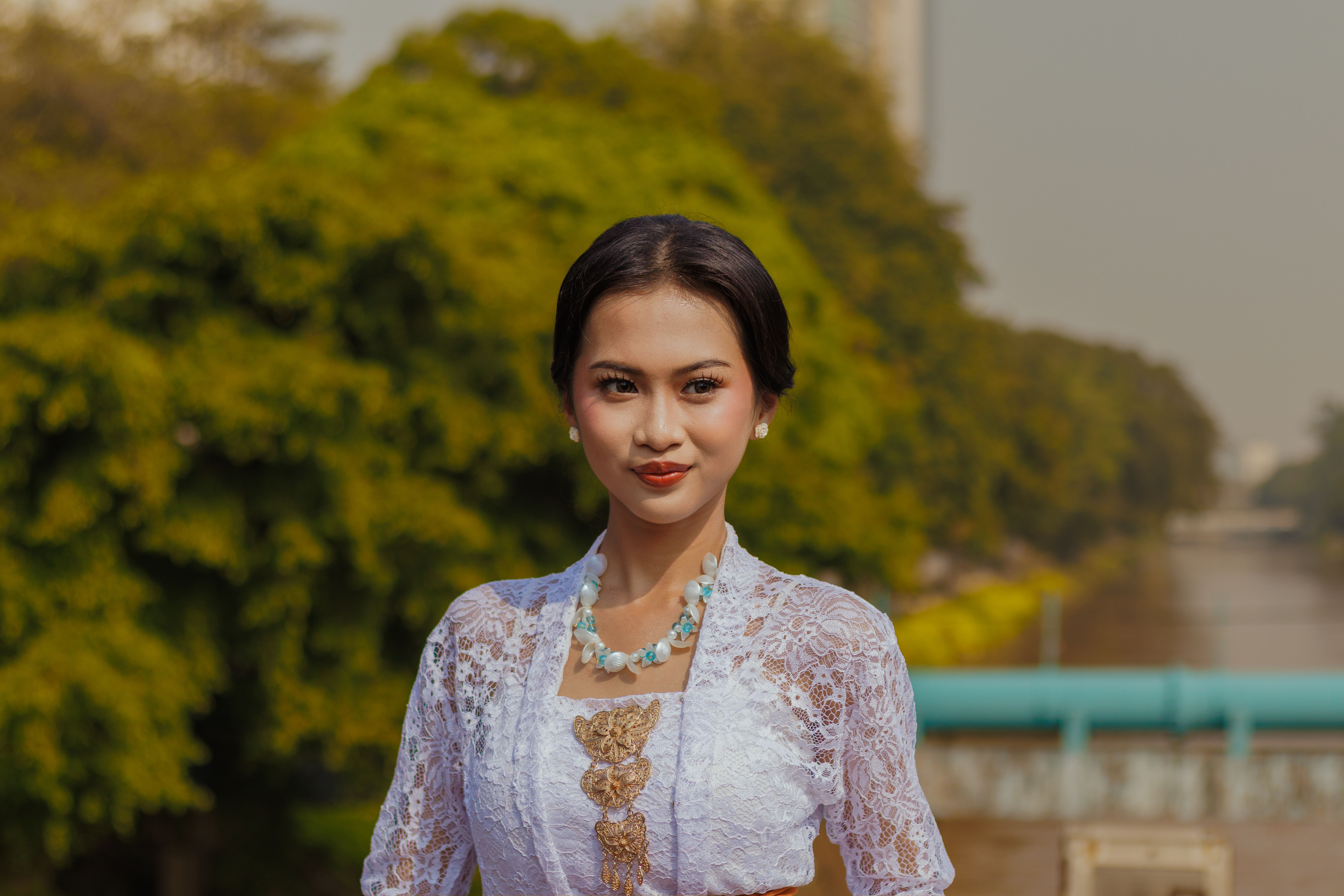 Elegant Woman in Traditional Dress Outdoors