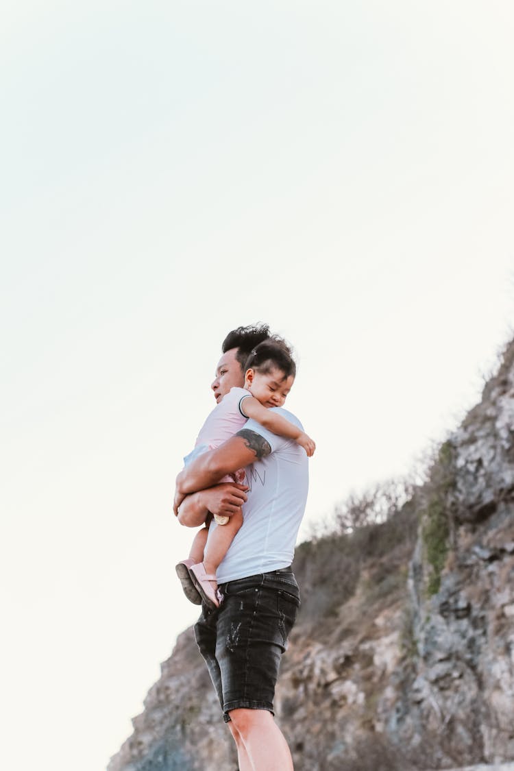 Man Carrying His Baby