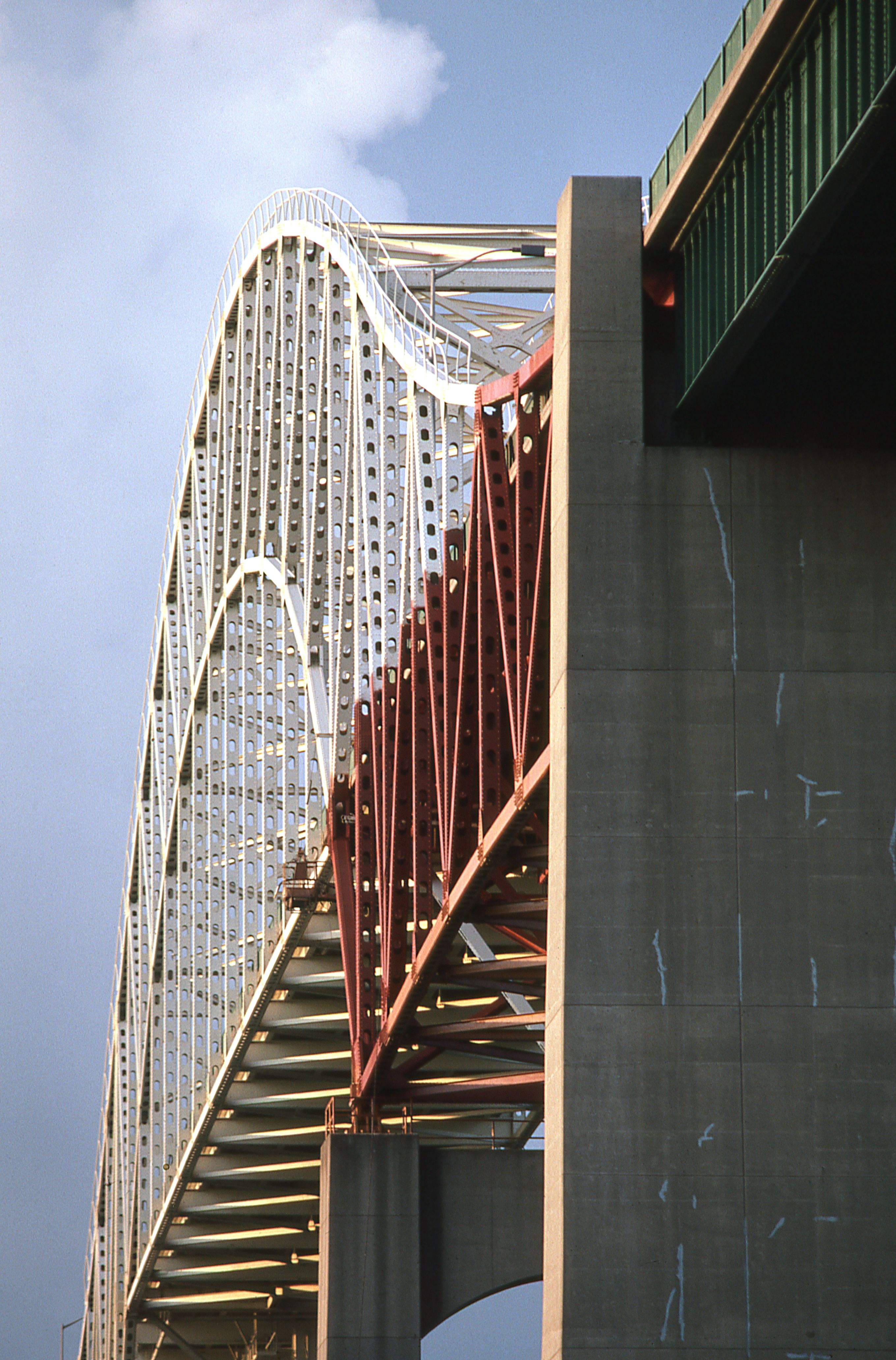 Close-up of arched steel bridge highlighting architectural design.