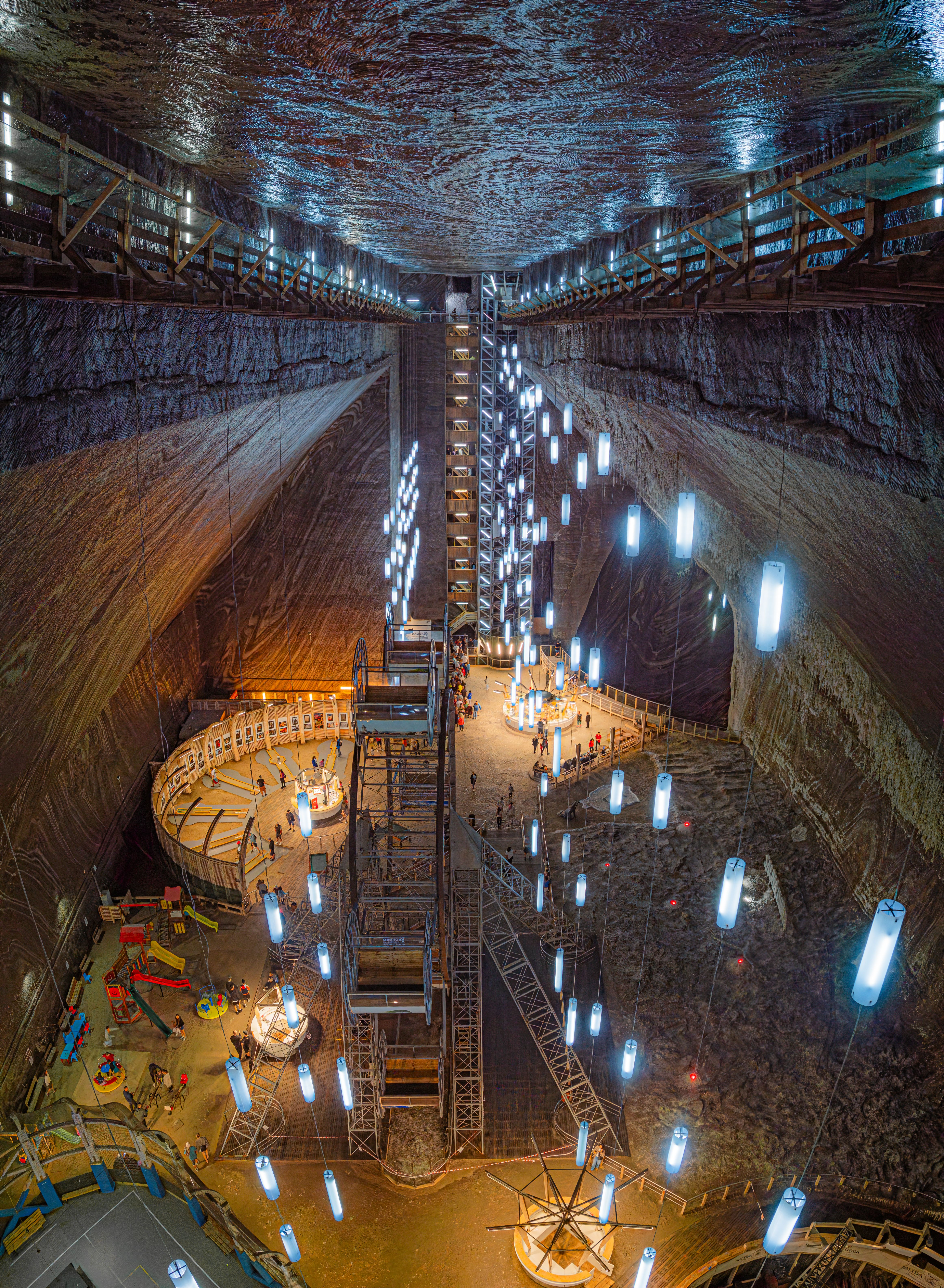 Explore the mesmerizing Salina Turda salt mine with its unique underground design and glowing lights.