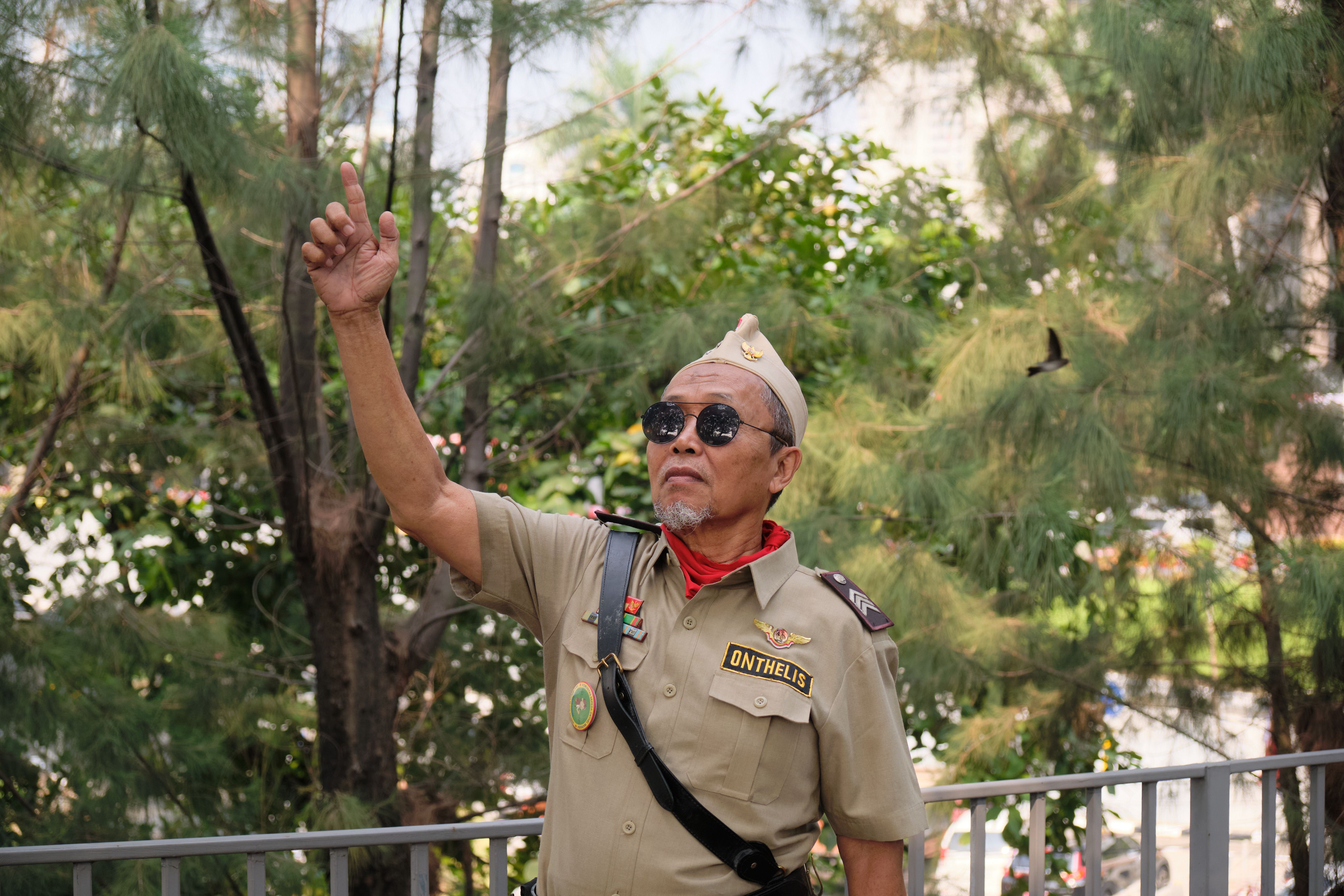 Elderly Man in Uniform Celebrates Indonesian Heritage