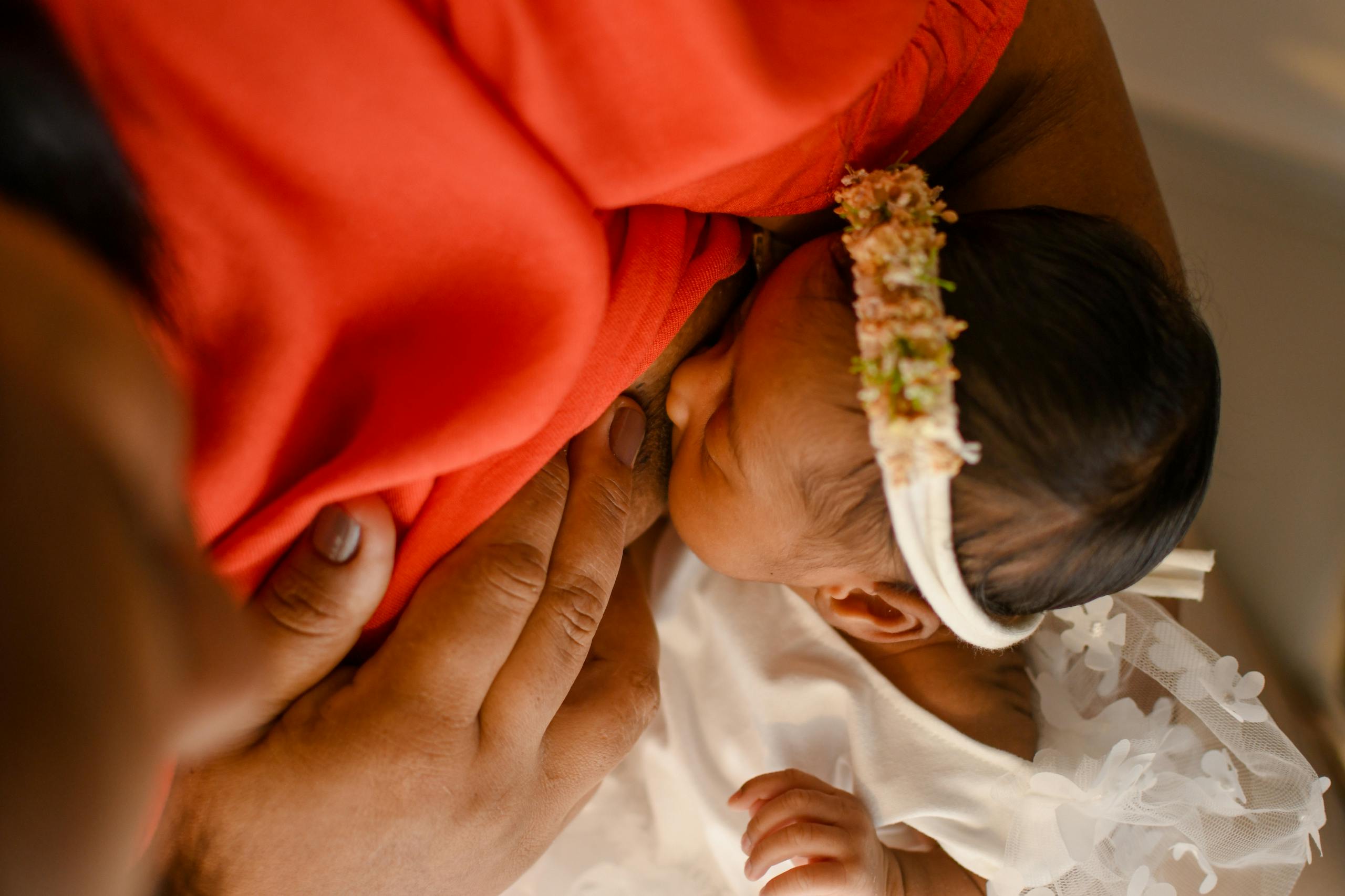 Free A close-up view of a mother breastfeeding her newborn baby with