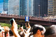 Crowd gathers for the annual rubber duck race on Columbus Bridge in Chicago.