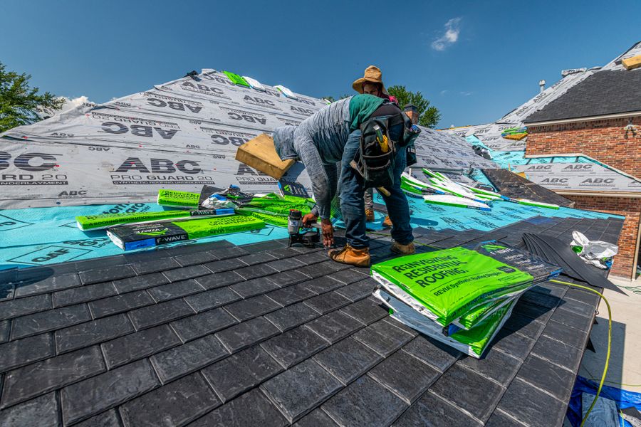 Synthetic underlayment down before a single shingle — the layer you never see keeps you dry.