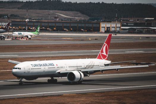Turkish Airlines aircraft taxiing at Istanbul Airport in Türkiye, showcasing aviation travel.